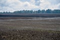 Steam and fog rise from the plowed field, preparing arable land for winter and spring crops Royalty Free Stock Photo