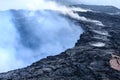Steam, gases and sulfuric acid rise from Kilauea caldera