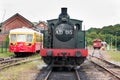 Steam locomotive and belgian railcar on display at Treignes, Belgium