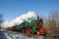 Steam locomotive with freight cars.