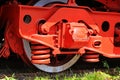 Red wheel and detail of mechanism a vintage romanian steam train locomotive Royalty Free Stock Photo