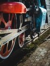 Steam train wheels and rods closeup. Detail of mechanical parts, wheels and equipment of the train Royalty Free Stock Photo