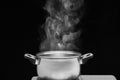 Steam over cooking pot in kitchen