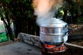 Steam over cooking pot on nature background Royalty Free Stock Photo