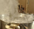 Steam over metal cooking pot