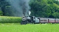 Steam Passenger Train Puffing along Amish Countryside