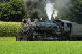 Steam Passenger Train Puffing along Amish Countryside