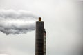 Steam and polluting smoke rises from the chimney of waste incinerator AEB in Amsterdam