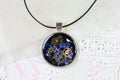 Steam Punk Style Pendant Necklace, Resin Art Multi Color Necklace, Resin pendant with cogs and timepiece Royalty Free Stock Photo