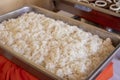 Steam rice served for buffet, catering service on celebration. Steamed rice in pan closeup. Traditional asian food