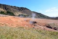 Steam Rising from Craters and Pock Marked Landscape
