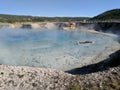 Steam rising from hot spring in crater Yellowstone National Park Royalty Free Stock Photo