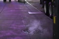 Steam Rising from a Manhole Cover on Sidewalk in New York City Royalty Free Stock Photo