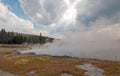 Steam rising off Black Warrior hot springs geyser and Hot Lake in Yellowstone National Parks Lower Geyser Basin in Wyoming USA Royalty Free Stock Photo