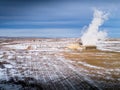 Steam rising at power generator under winter skies Royalty Free Stock Photo