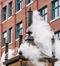 Steam street clock doing the noon chime in Vancouver, Canada Royalty Free Stock Photo