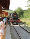 Steam train arriving at the small train station