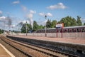 A steam train, bellowing steam and smoke at the aviemore train station