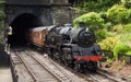 A Steam Train Emerges from a Tunnel