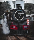 Steam train leaving the station Royalty Free Stock Photo