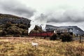 Steam train passing through autumn llanberis scenery Royalty Free Stock Photo