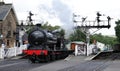 Steam train passing through Grosmont station on the North Yorkshire Moors Railway, the UK Royalty Free Stock Photo