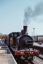 Steam train on the platform at Sheringham station, Norfolk, UK