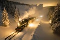 a steam train traveling through a snowy landscape Royalty Free Stock Photo
