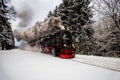 Steam train on the way to Brocken through winter landscape