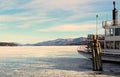 Steamboat moored for winter in snow and ice of lake