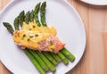 Steamed asparagus with baked salmon filet and hollandaise sauce on the top. Royalty Free Stock Photo