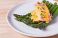 Steamed asparagus with baked salmon filet and hollandaise sauce on the top. Royalty Free Stock Photo