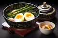 steamed asparagus and soft-boiled quail eggs served in a deep dish Royalty Free Stock Photo