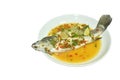 Steamed bass fish dressing lemon sweet and sour chili sauce on plate