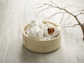 Steamed BBQ Pork bun with Oyster Sauce served in a wooden bowl isolated on mat side view on grey background Royalty Free Stock Photo