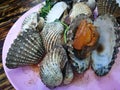 Steamed blanched clams with dipping sauce.