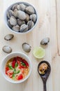 Steamed blanched clams in white bowl and spicy dipping sauce Royalty Free Stock Photo