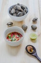 Steamed blanched clams in white bowl and spicy dipping sauce Royalty Free Stock Photo