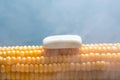 Steamed boiled corn with butter on a blue background. Royalty Free Stock Photo