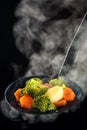 Steamed vegetables and steam.