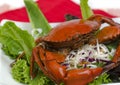 Steamed brown crab on salad.