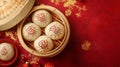 Steamed Buns with Chinese Characters in a Bamboo Steamer on a Red Background Royalty Free Stock Photo