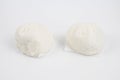 Steamed buns with minced pork on bamboo cutting board. Chinese food dim sum style on white background. Royalty Free Stock Photo