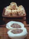 Steamed buns with minced pork filling and Pork shumai or Chinese steamed dumpling served with sour sauce Royalty Free Stock Photo