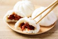 Steamed buns stuffed with red minced pork