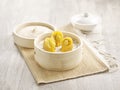 Steamed Chicken and PigÃ¢â¬â¢s Stomach with White Pepper Dumpling served in a wooden bowl with chopsticks isolated on mat side view Royalty Free Stock Photo