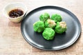 Steamed Chinese jade dumpling filling minced shrimp or dim sum dipping soy sauce on plate Royalty Free Stock Photo