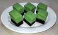 steamed chocolat pandan brownie on a white plate Royalty Free Stock Photo