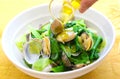 Steamed clams with vegetables and oil in white bowl Royalty Free Stock Photo