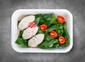 Steamed cutlets made of three kinds of meat. Healthy diet. Takeaway food. Eco packaging.Top view, on a gray background